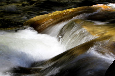 Close-up of water flowing in river