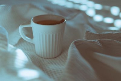 Close-up of coffee cup on table