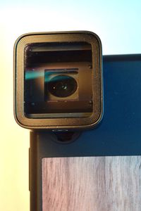 Close-up of camera against wall