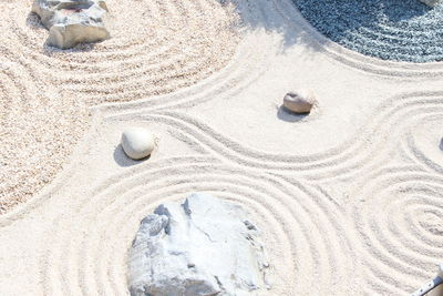 High angle view of footprints on sand