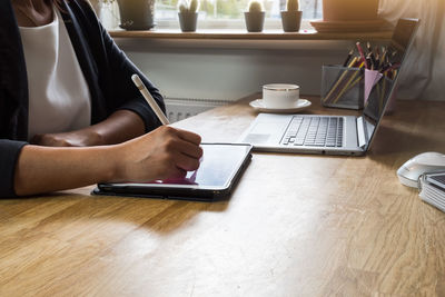 Man using laptop on table