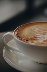 Close-up of cappuccino on table