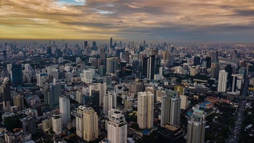 High angle view of modern buildings in city against sky