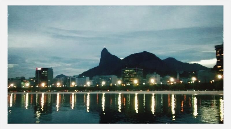 water, waterfront, sky, architecture, built structure, building exterior, reflection, lake, mountain, river, dusk, illuminated, silhouette, tranquil scene, night, cloud - sky, nature, tranquility, sea, outdoors