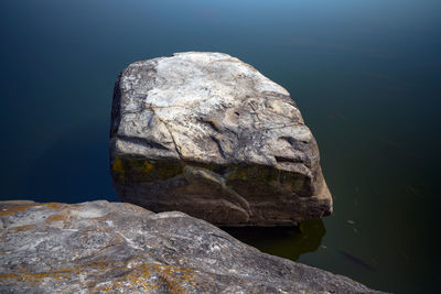 Close-up of rock formation in lake