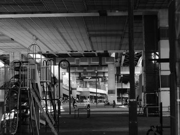 People in illuminated building at night