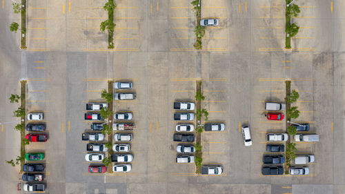 High angle view of cars on road amidst buildings in city