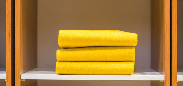 Close-up of yellow towels on table