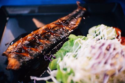 Close-up of meat on barbecue grill