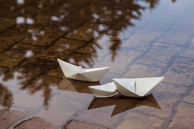 High angle view of paper floating on water