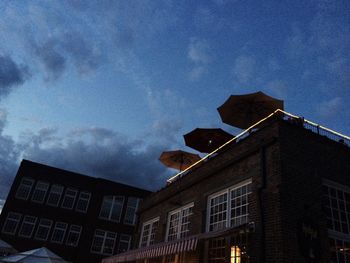 Low angle view of building against cloudy sky