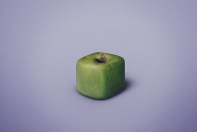 High angle view of apple against blue background