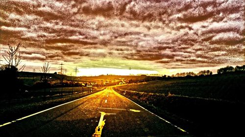 Road against sky during sunset