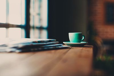 Close-up of coffee cup on table