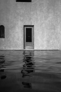 Rear view of woman standing in water