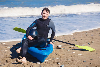 Portrait of smiling young man on beach