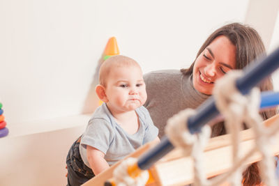 Rear view of friends and son at home