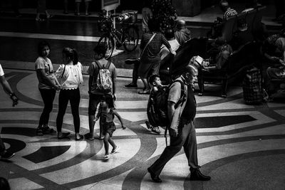 People walking on street in city