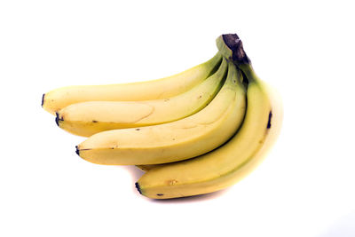 Close-up of bananas against white background