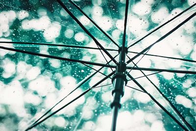 Low angle view of raindrops on glass