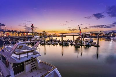 Boats moored at harbor