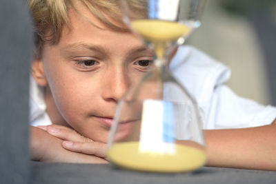 Close-up portrait of boy holding drink