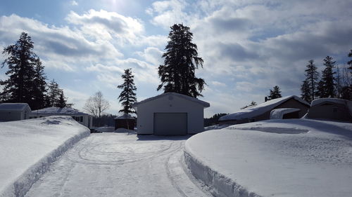 Built structure on snow against sky