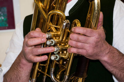 Close-up of man playing musical equipment