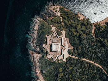 Aerial view of building by sea