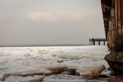 Scenic view of sea against sky during winter