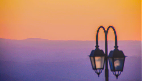 Scenic view of sea against orange sky