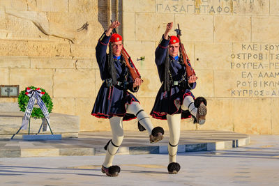 Group of people walking on wall