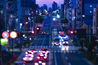 High angle view of illuminated city street at night