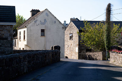 Street amidst buildings against sky