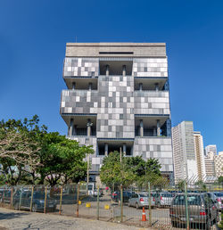 Low angle view of building against clear blue sky