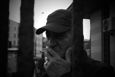 Portrait of man smoking cigarette