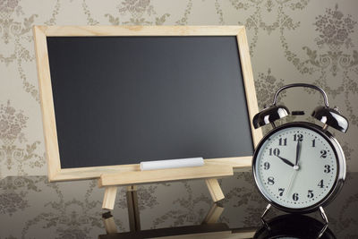 Close-up of clock on table