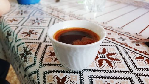 High angle view of coffee cup on table