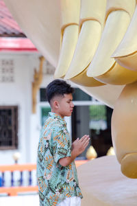 Boy praying for blessings.