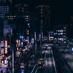 Illuminated city street at night