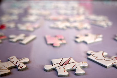 Close up of jigsaw puzzle pieces on table
