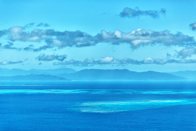 Scenic view of sea against blue sky