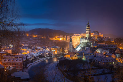 High angle view of illuminated buildings in city at night