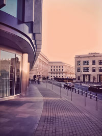 Buildings in city at sunset