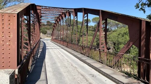 View of abandoned bridge against sky