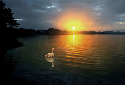 Scenic view of lake against sky during sunset