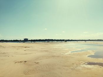 View of beach against clear sky