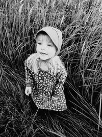 Cute girl standing on field