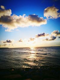 Scenic view of sea against sky at sunset