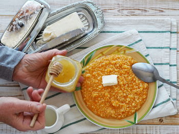 High angle view of man preparing food on table